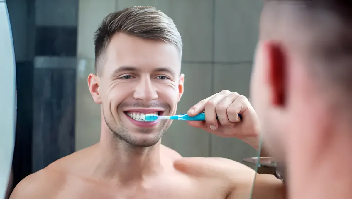 A man brushing his teeth with Best Travel Toothbrushes