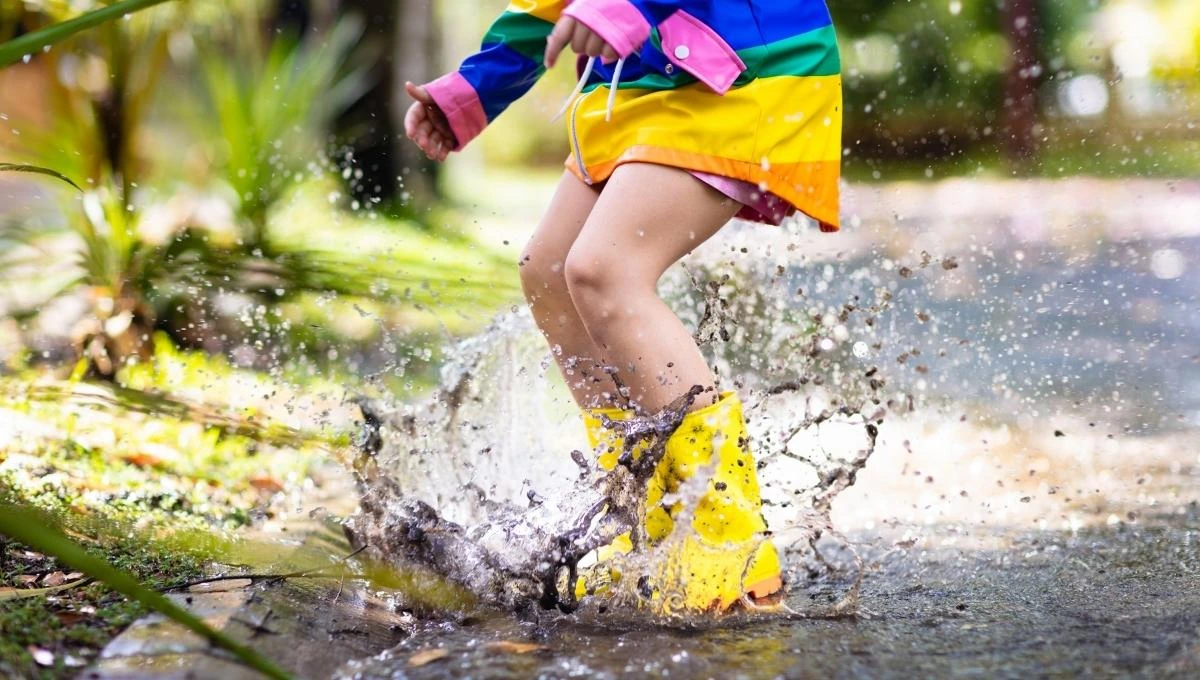 Girl jumping in water and wearing Best Waterproof Shoes For Women