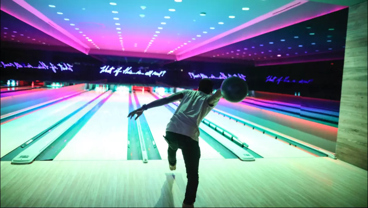 A boy doing bowling at Basement nightclub | Best Indoor Activities In Miami
