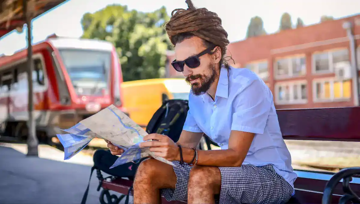 A Solo Traveler checking map on train station