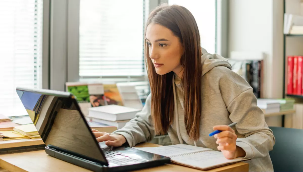 Girl gathering knowledge for travel on Laptop