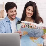 Couple planning for travel | Things Not to Forget When Traveling Internationally